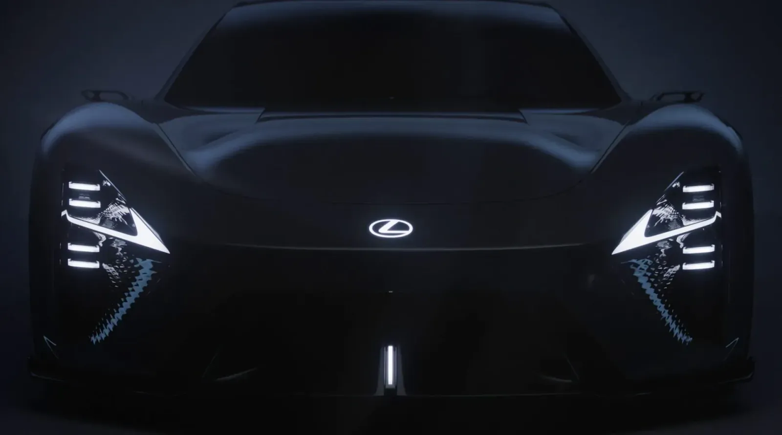 Lexus LFA Concept BEV sports car front view with glowing angular headlights and Lexus logo, dark futuristic setting.