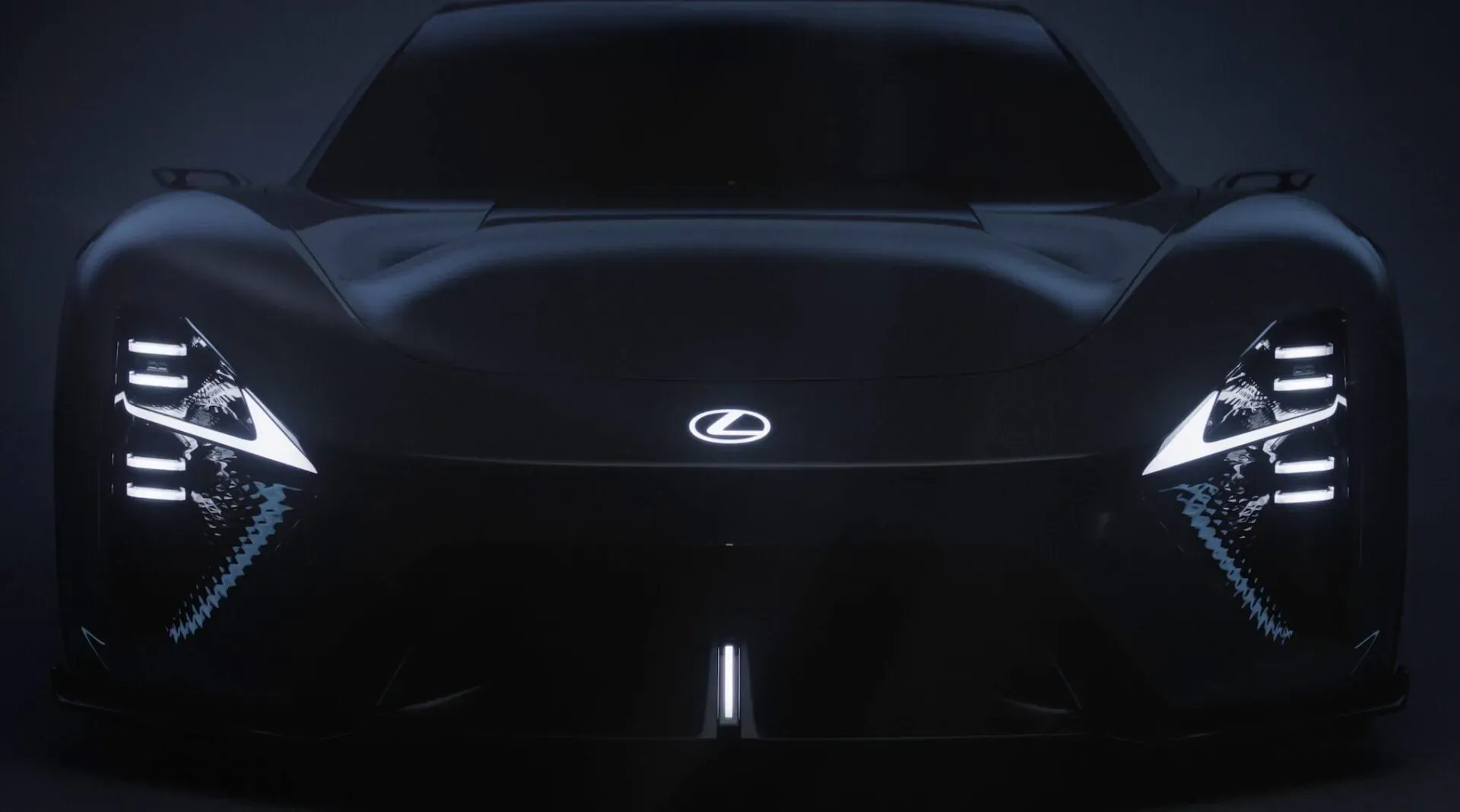 Lexus LFA Concept BEV sports car front view with glowing angular headlights and Lexus logo, dark futuristic setting.
