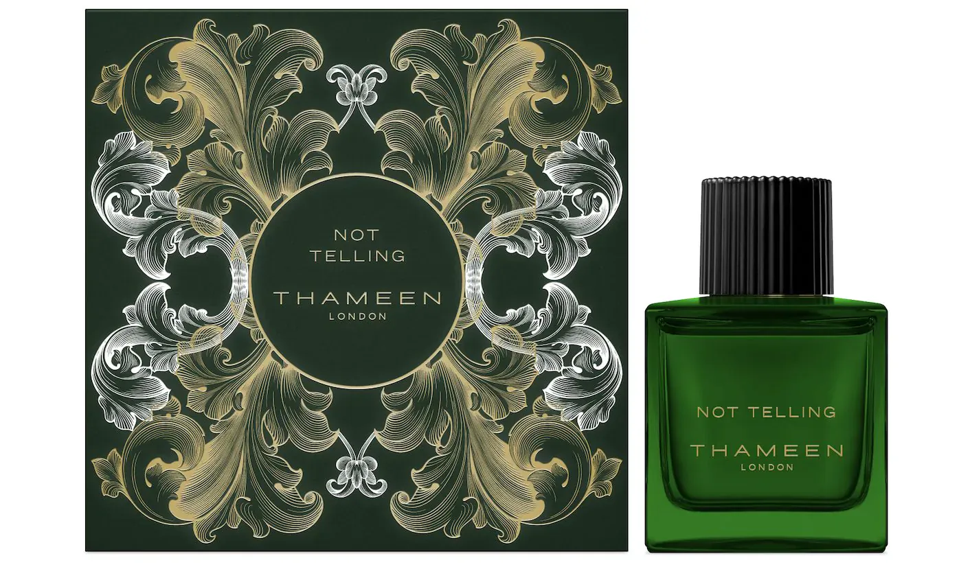 Thameen Not Telling green perfume bottle and ornate emerald box with 'Not Telling Thameen London' text.