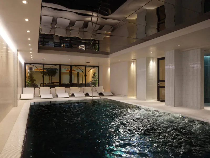 Elegant indoor pool with black water, white loungers, mirrored ceiling, and large windows in modern luxury spa.