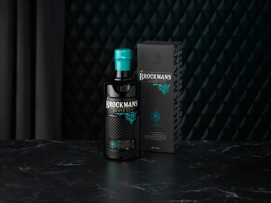 Brockmans Agave Cut gin bottle with turquoise cap and matching black box on dark surface