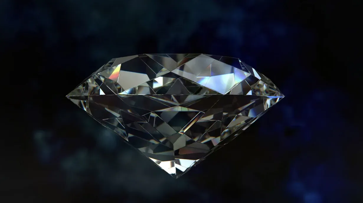 Sparkling round brilliant-cut diamond on dark blue background, featured engagement ring shape